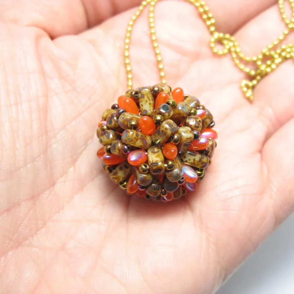 Handwoven Fall color beaded bead pendant